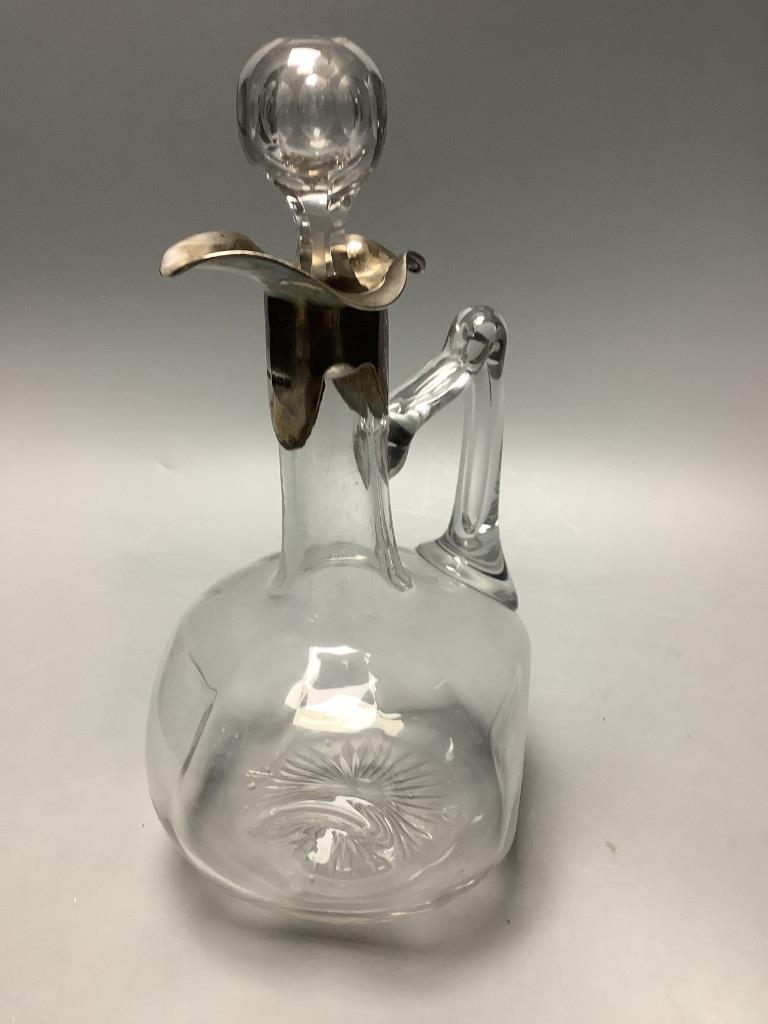 An Edwardian silver mounted glass claret jug with glass stopper, by Horton and Allday, Birmingham 1906, overall height 24.9 cm.